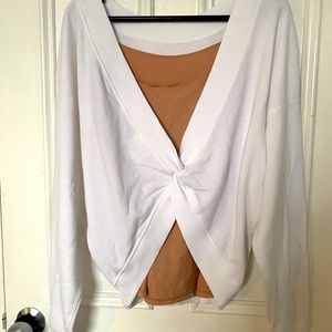 Like new white sweatshirt with a twist that can be worn at the back or front
